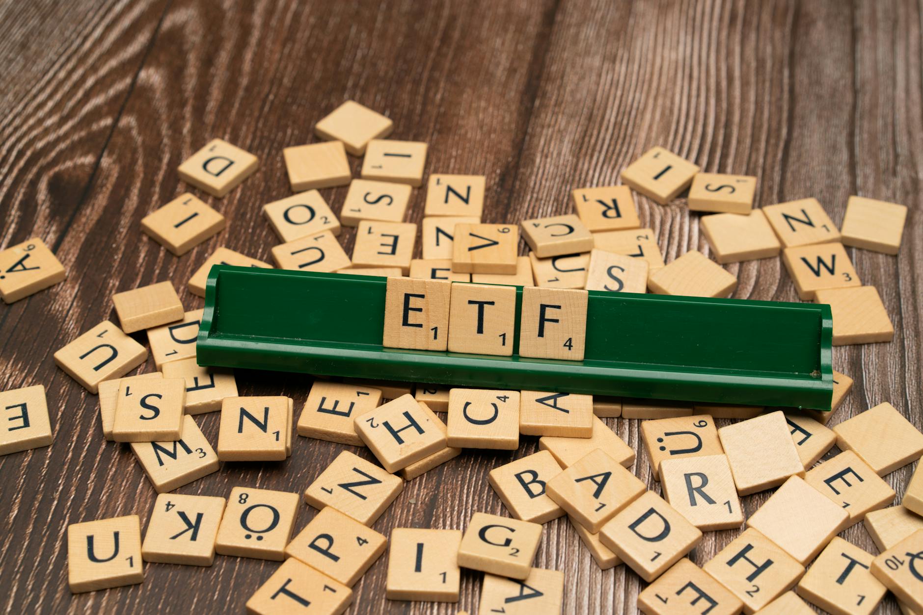 https://www.pexels.com/photo/the-word-etf-on-a-wooden-board-with-scrabble-tiles-18524062/