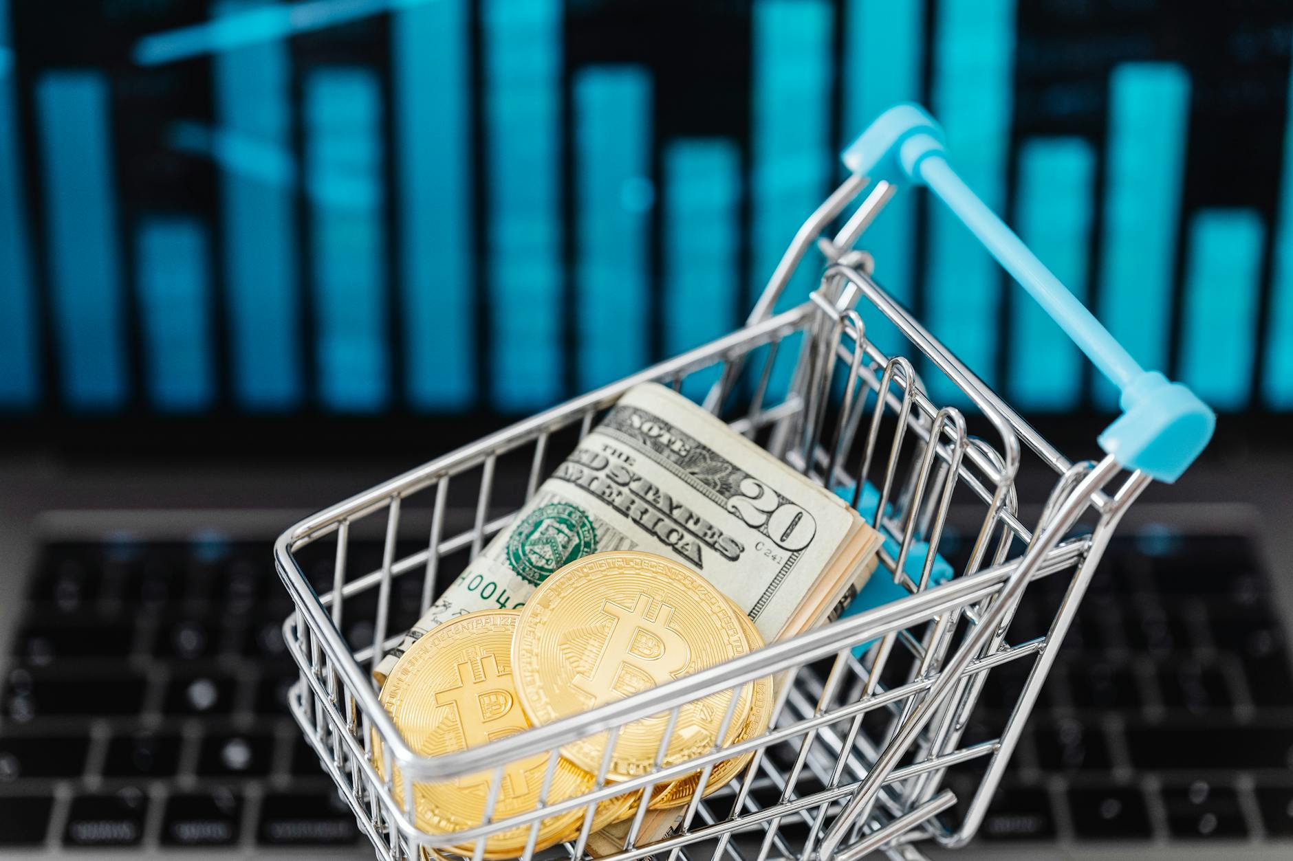 https://www.pexels.com/photo/gold-bitcoin-coins-and-cash-in-a-miniature-shopping-cart-5980876/